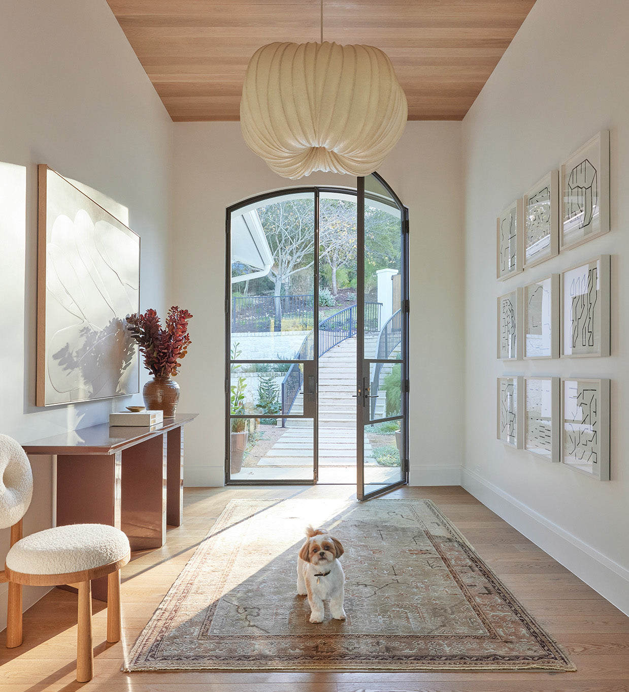 an interior view with midcentury modern furniture and northern wide wood planks on the floor