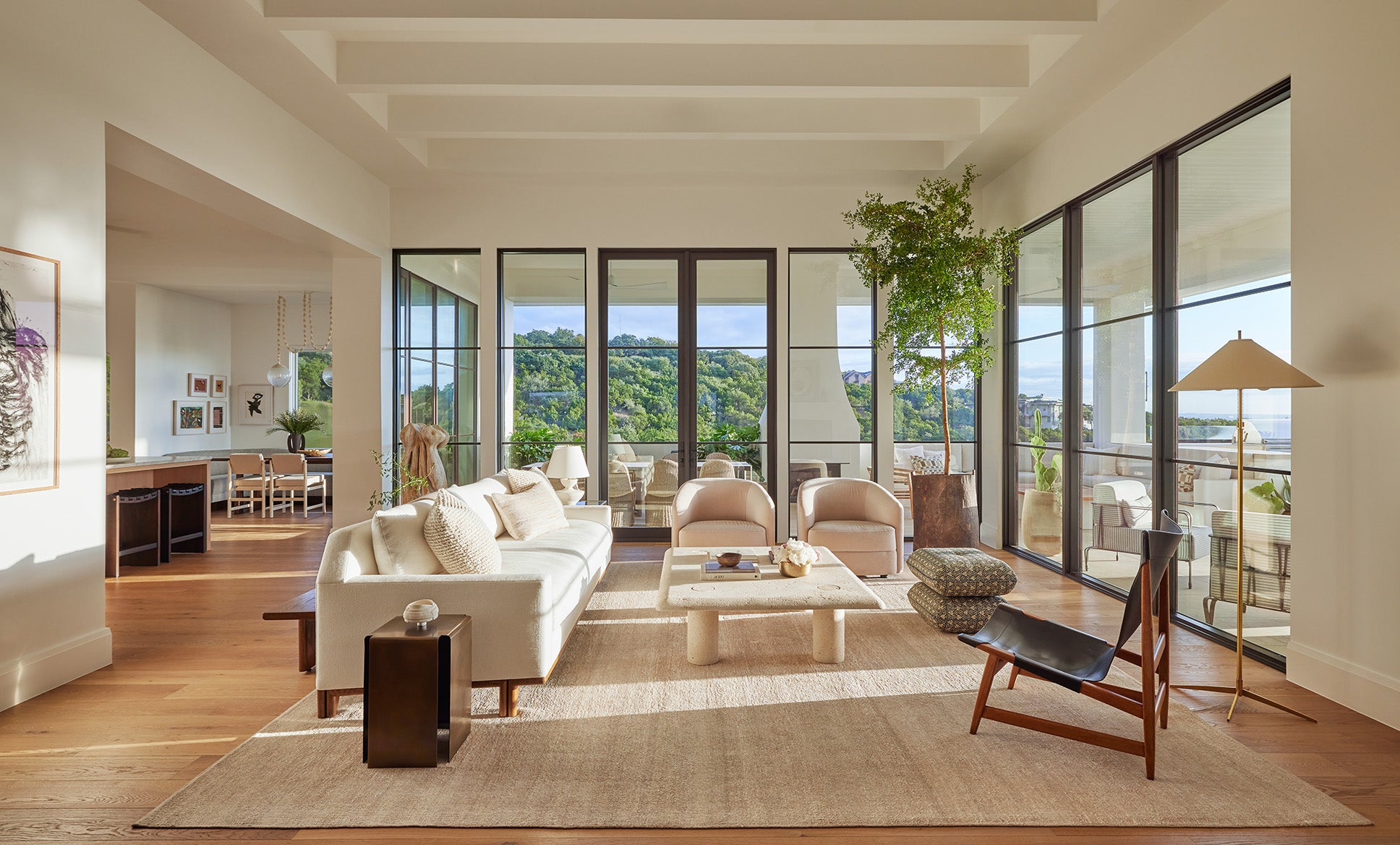 an interior view with midcentury modern furniture and northern wide wood planks on the floor