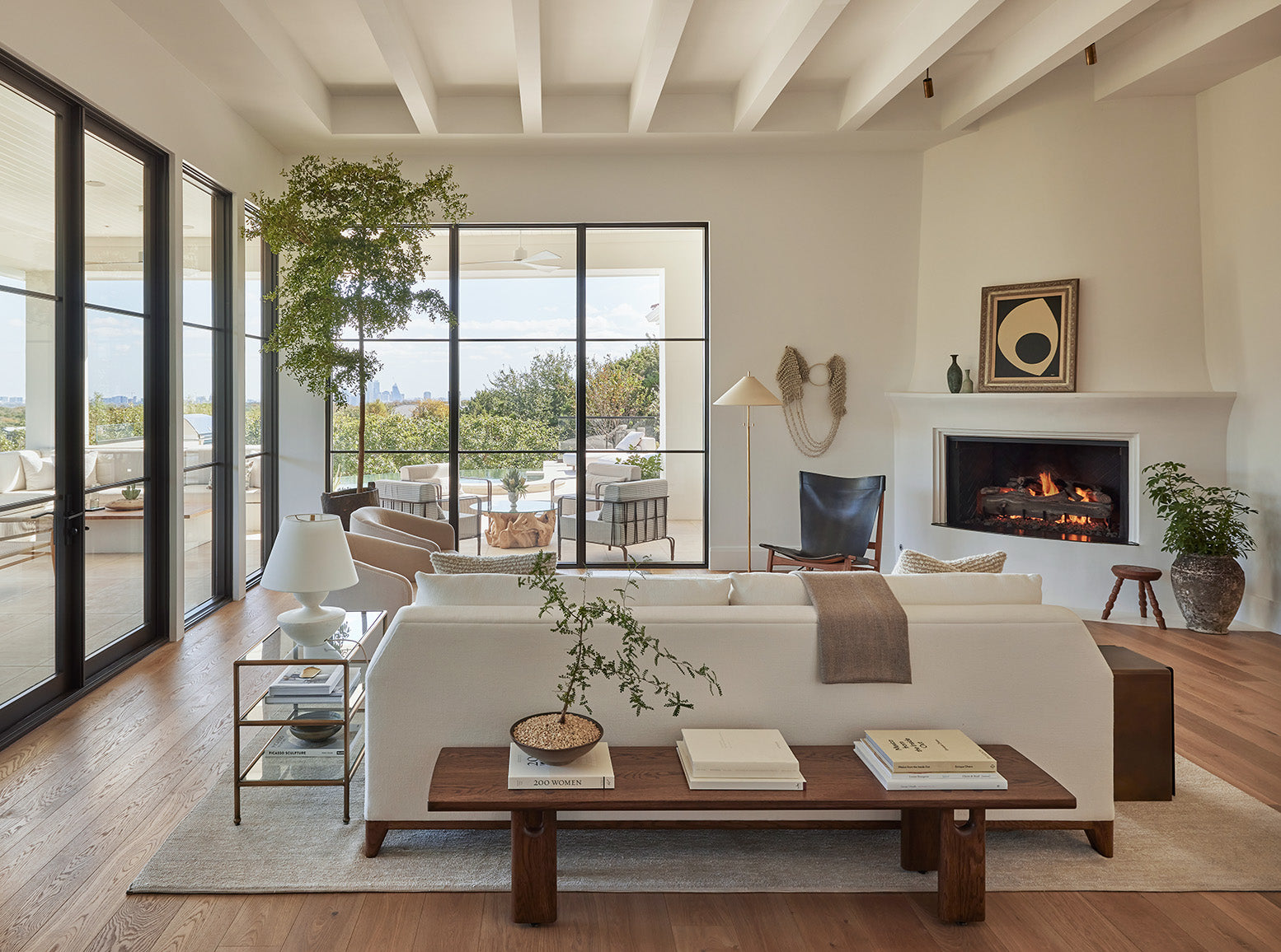 an interior view with midcentury modern furniture and northern wide wood planks on the floor