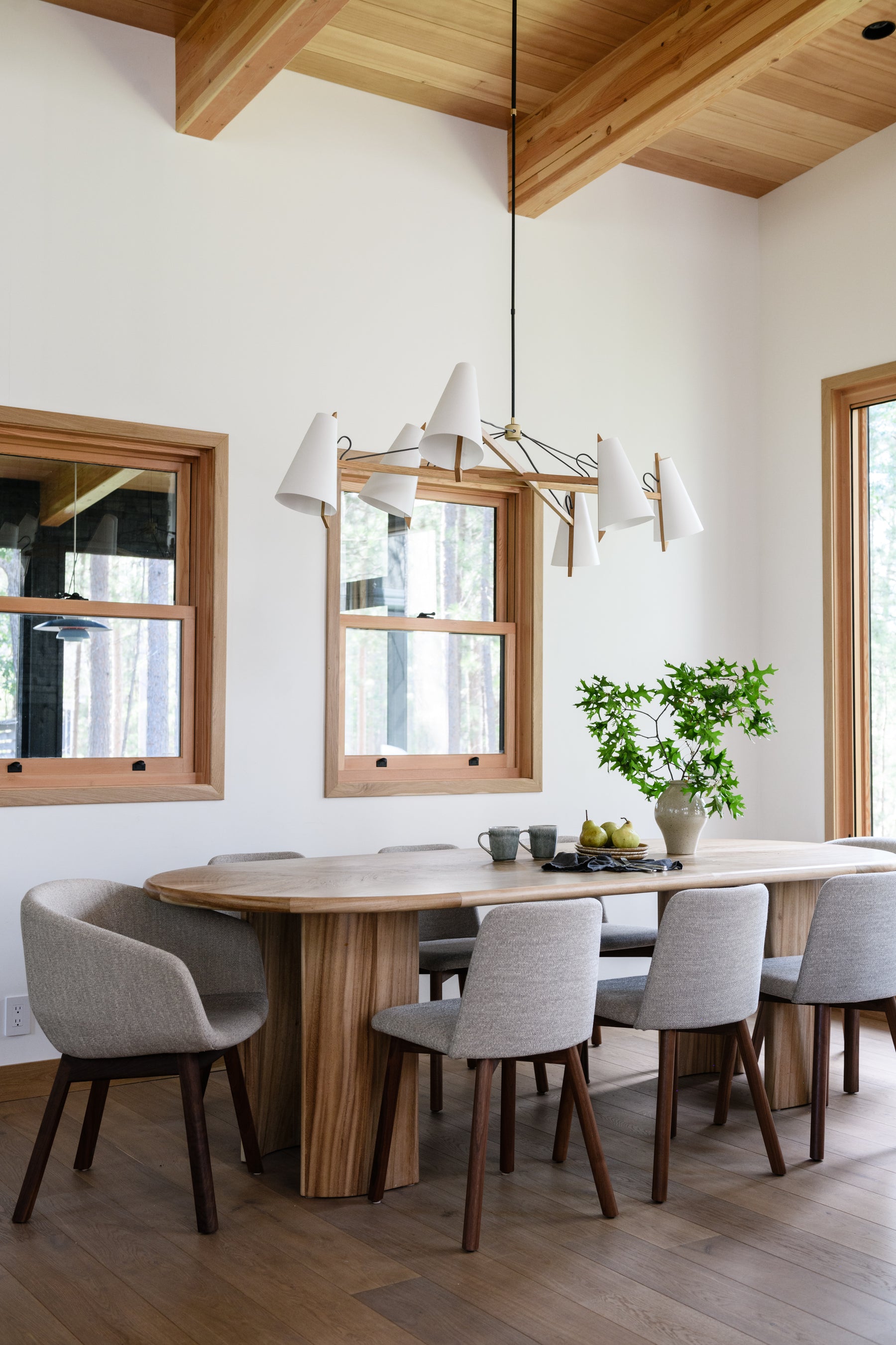 an interior view with midcentury modern furniture and northern wide wood planks on the floor