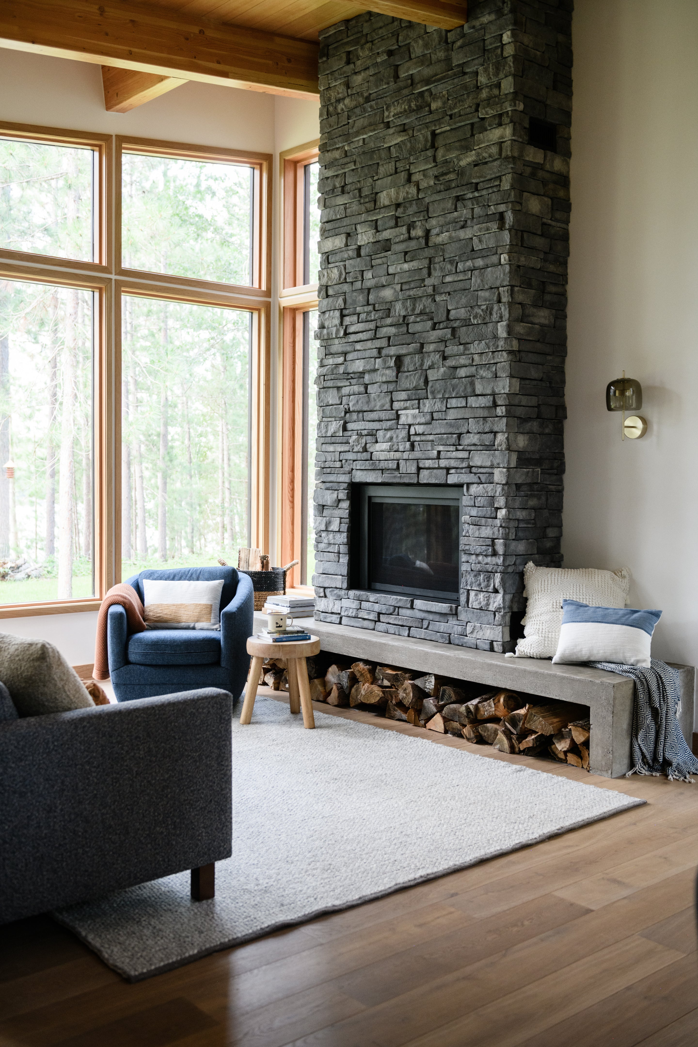 an interior view with midcentury modern furniture and northern wide wood planks on the floor