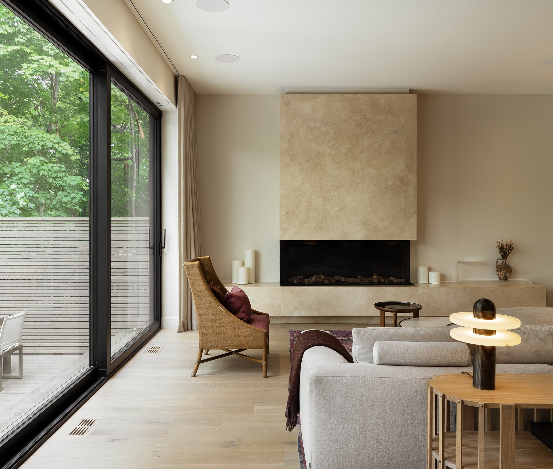 an interior view with midcentury modern furniture and northern wide wood planks on the floor