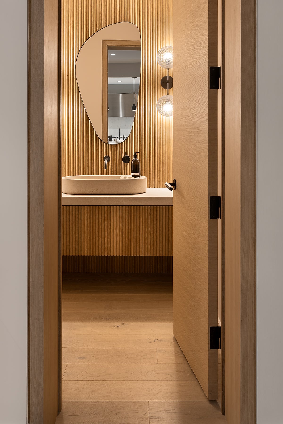 an interior view with midcentury modern furniture and northern wide wood planks on the floor