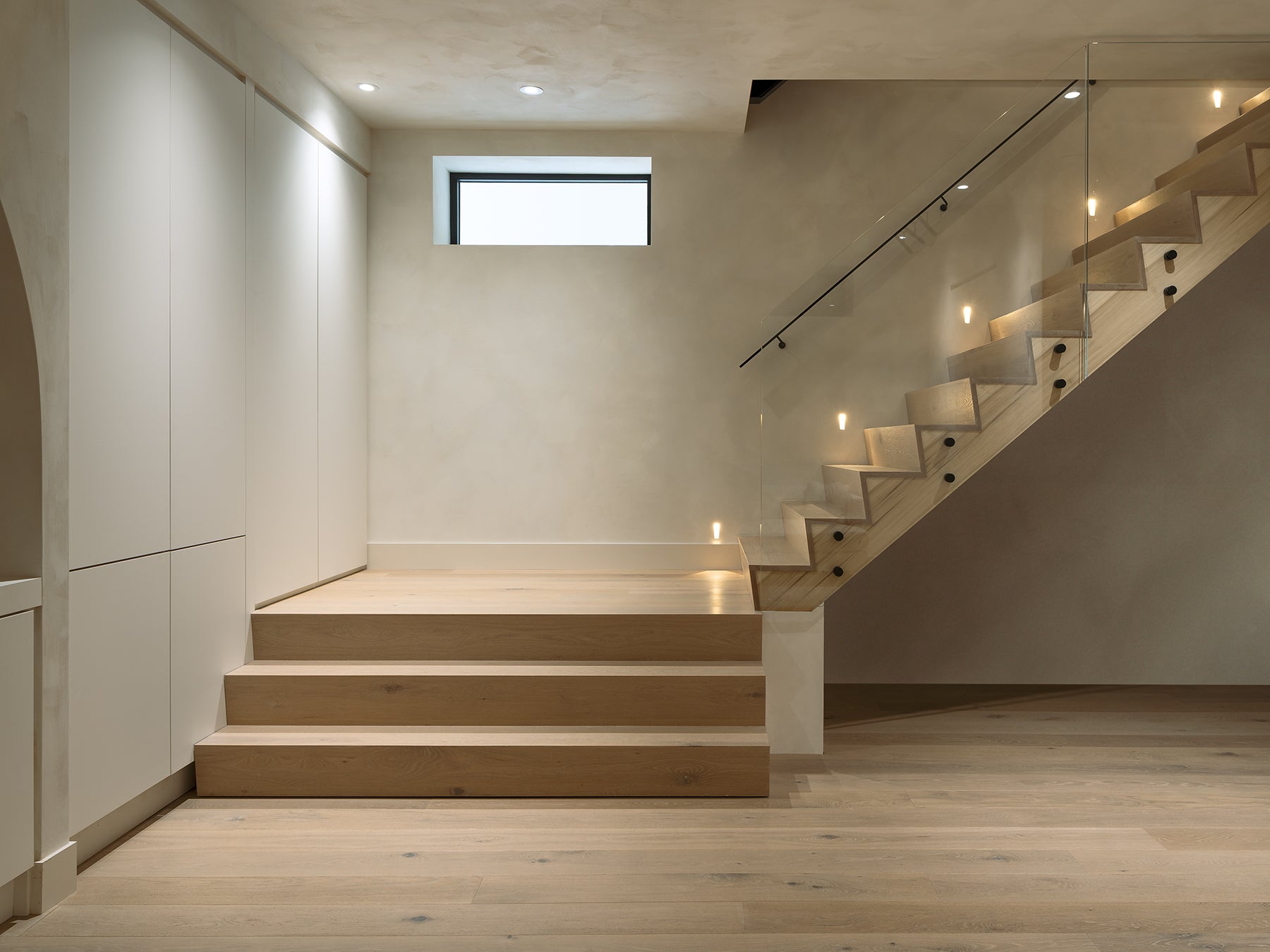 an interior view with midcentury modern furniture and northern wide wood planks on the floor