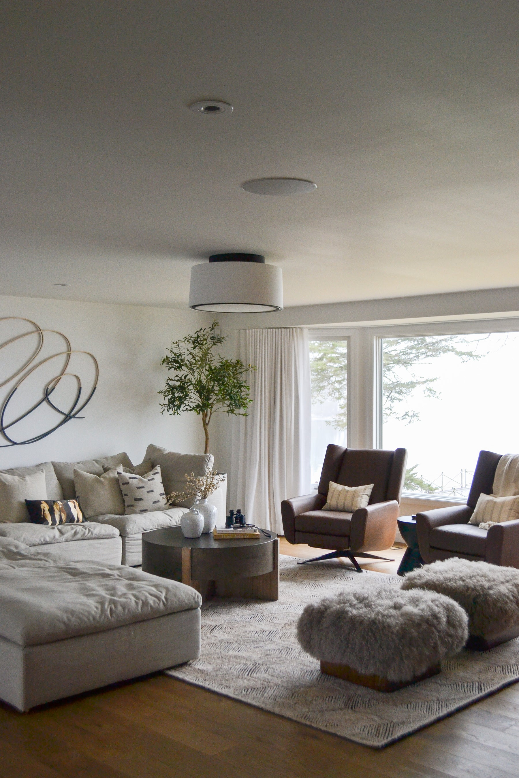 an interior view with midcentury modern furniture and northern wide wood planks on the floor