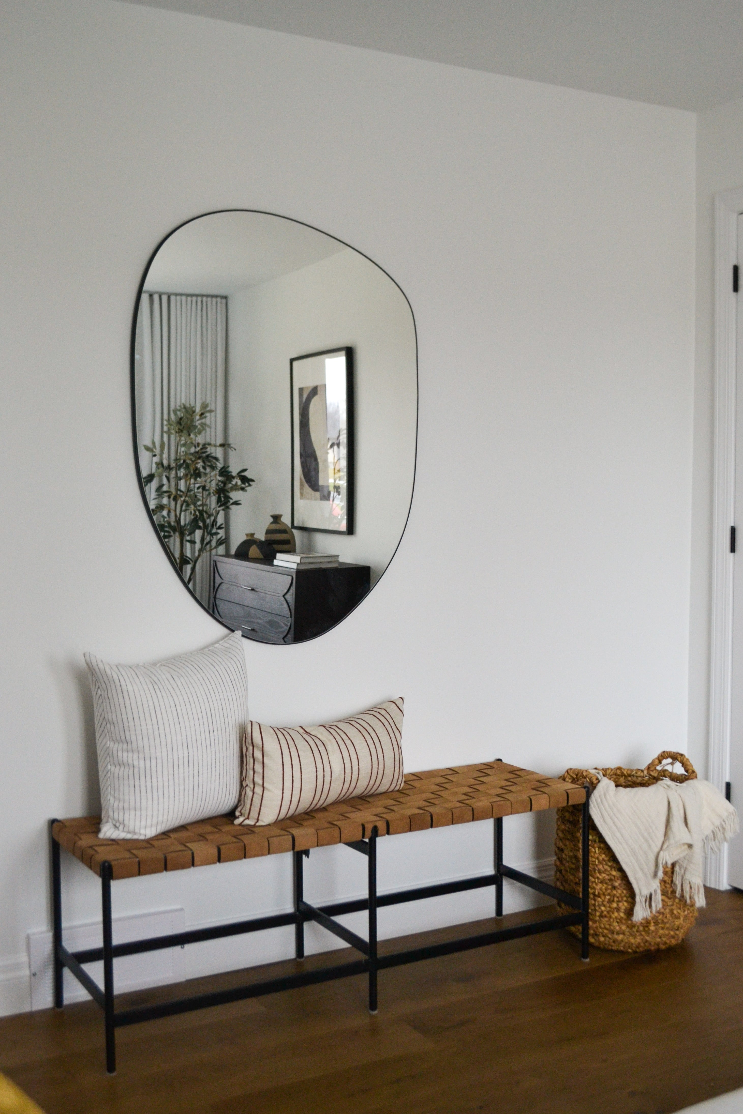 an interior view with midcentury modern furniture and northern wide wood planks on the floor