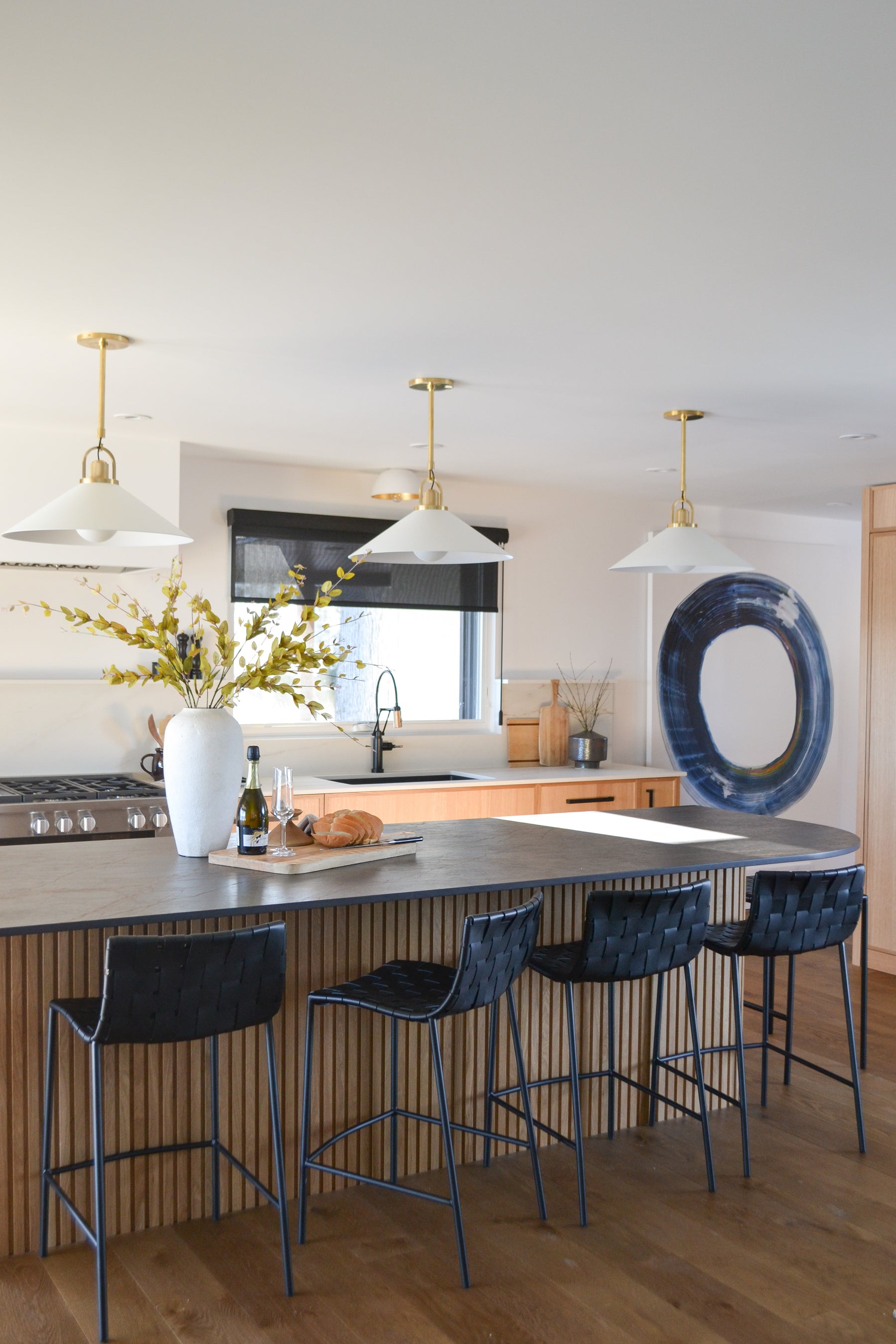 an interior view with midcentury modern furniture and northern wide wood planks on the floor