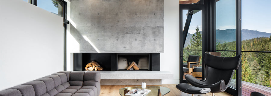 an interior view with midcentury modern furniture and northern wide wood planks on the floor