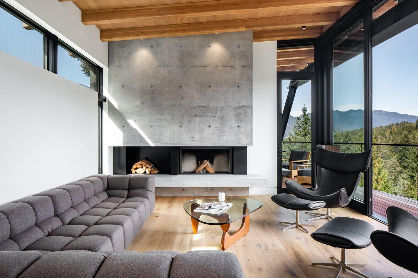 an interior view with midcentury modern furniture and northern wide wood planks on the floor