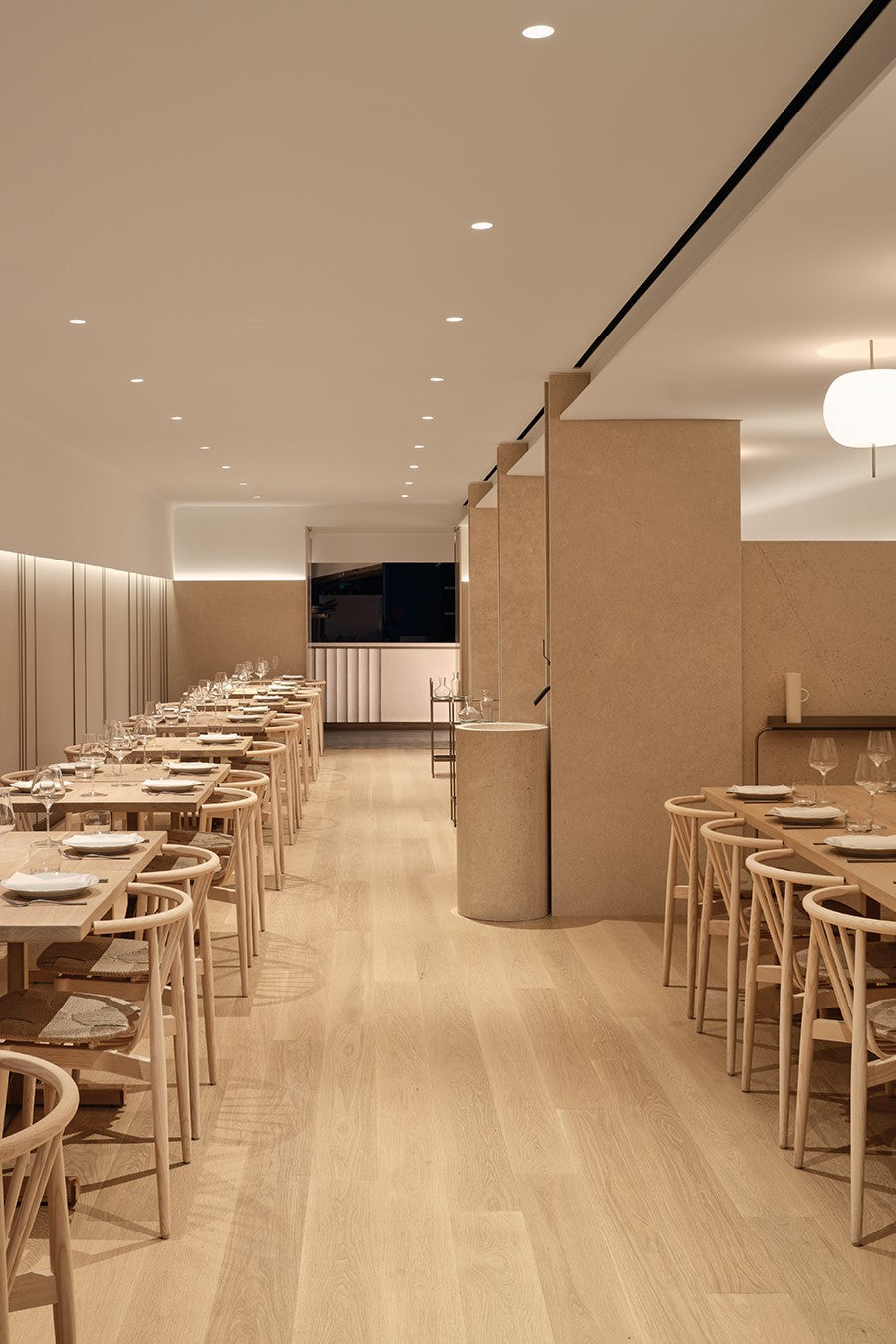 an interior view with midcentury modern furniture and northern wide wood planks on the floor