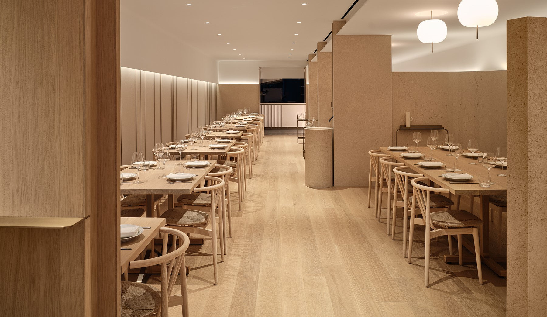 an interior view with midcentury modern furniture and northern wide wood planks on the floor