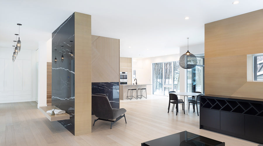 an interior view with midcentury modern furniture and northern wide wood planks on the floor