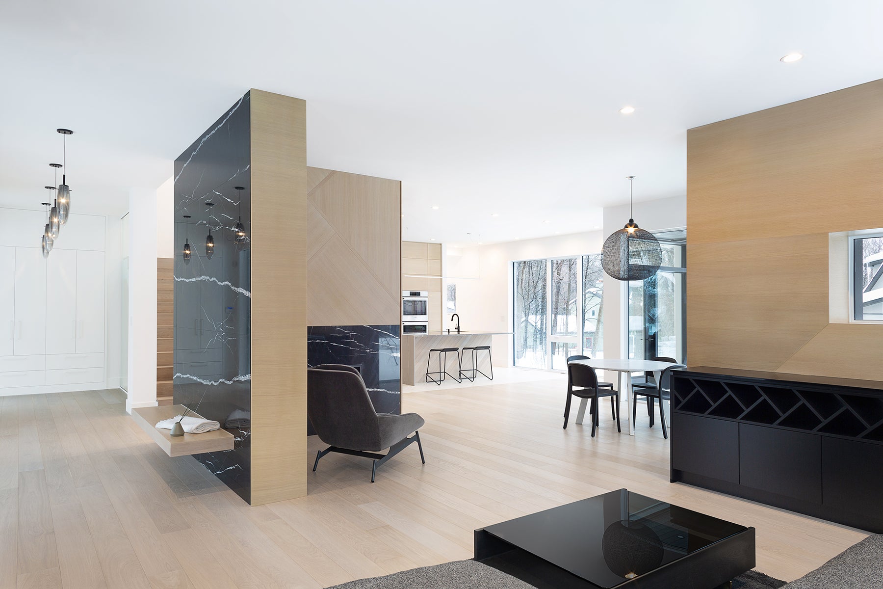 an interior view with midcentury modern furniture and northern wide wood planks on the floor