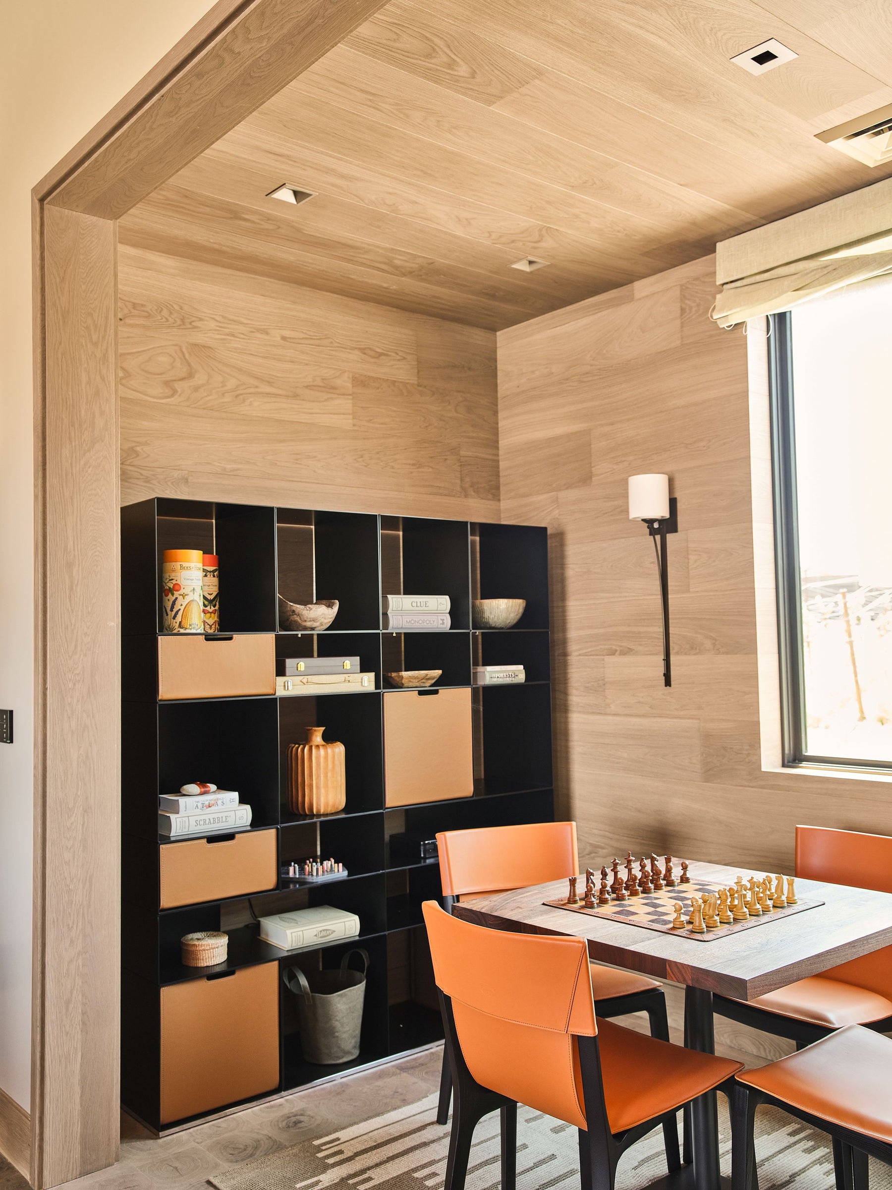 an interior view with midcentury modern furniture and northern wide wood planks on the floor