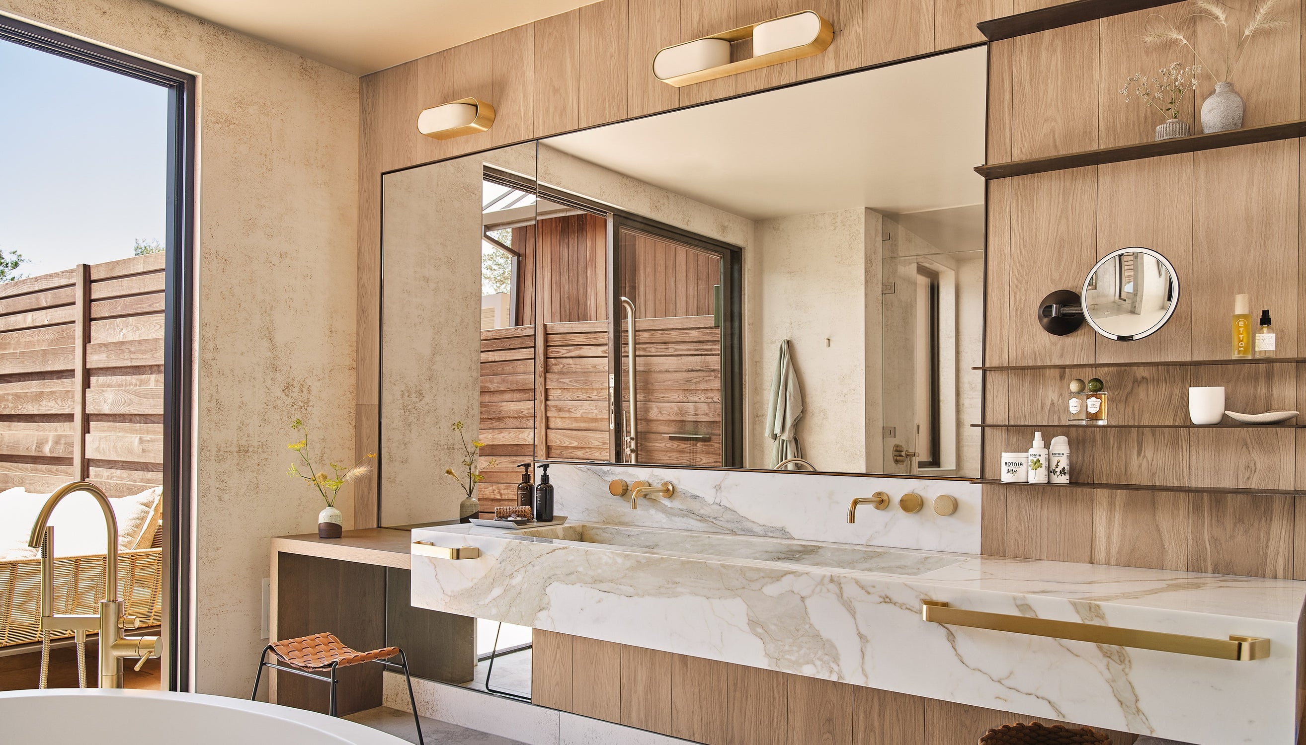 an interior view with midcentury modern furniture and northern wide wood planks on the floor