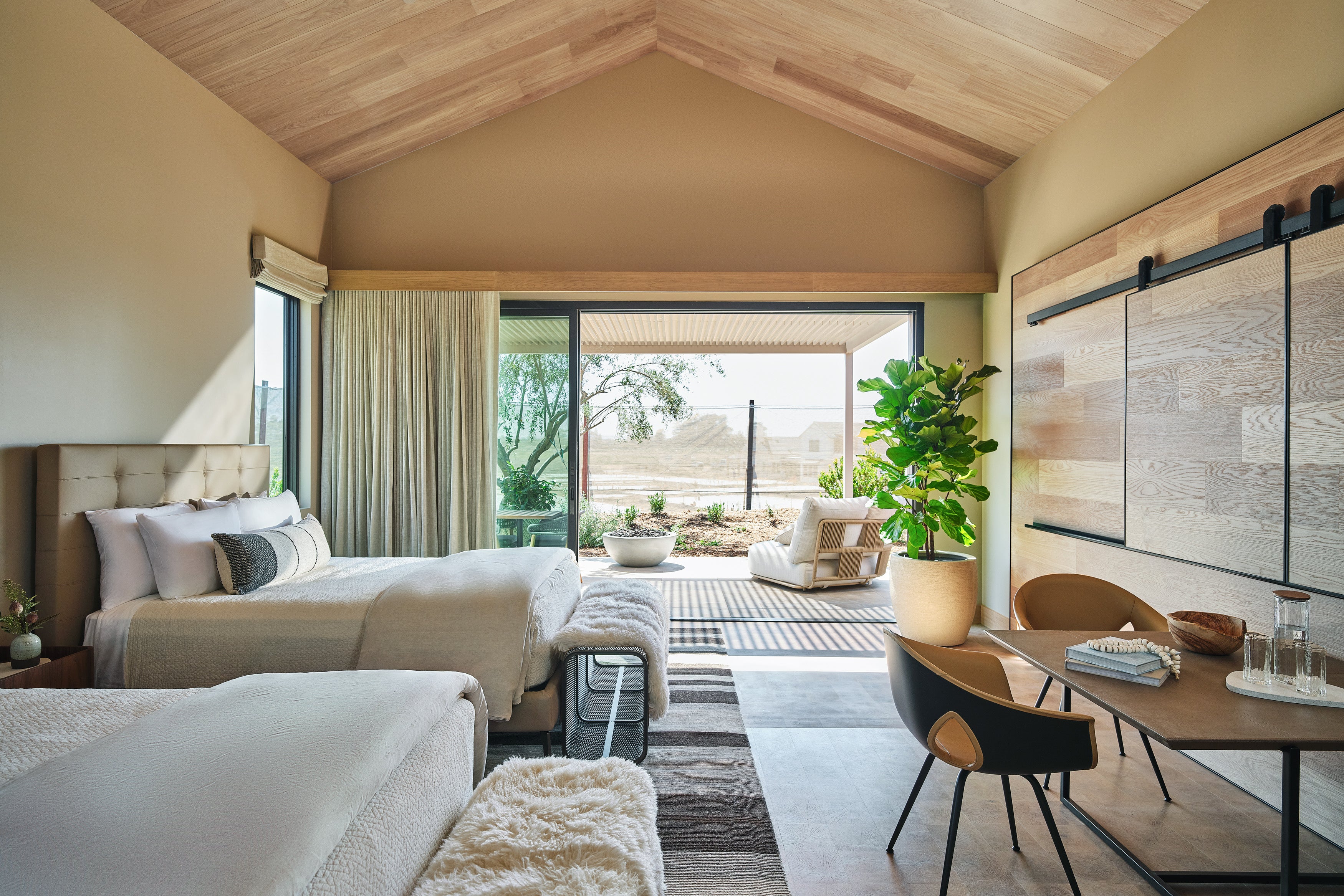 an interior view with midcentury modern furniture and northern wide wood planks on the floor