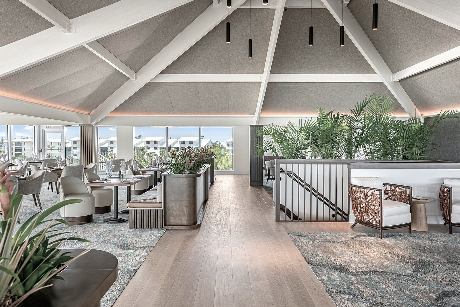 an interior view with midcentury modern furniture and northern wide wood planks on the floor