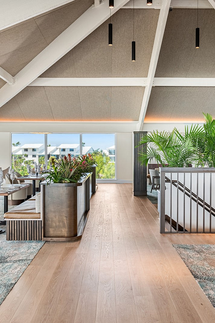 an interior view with midcentury modern furniture and northern wide wood planks on the floor