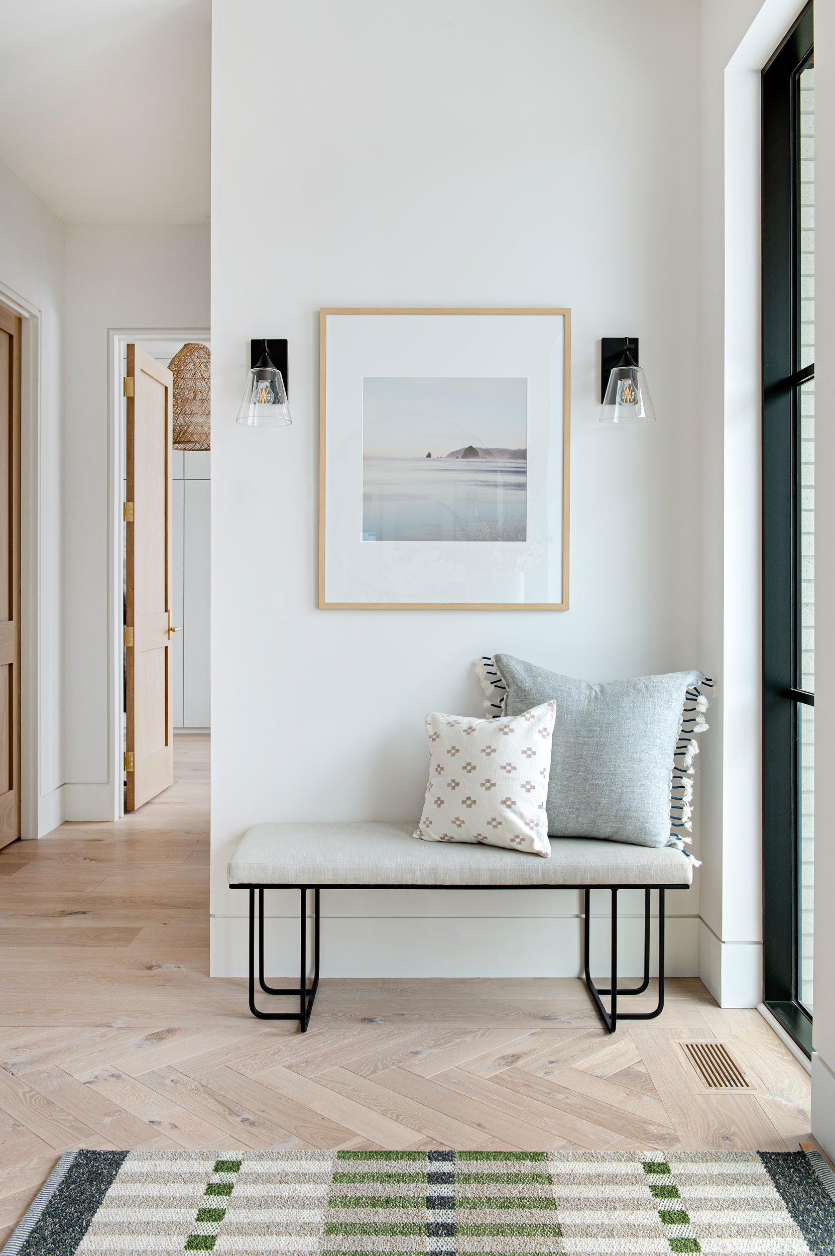 an interior view with midcentury modern furniture and northern wide wood planks on the floor