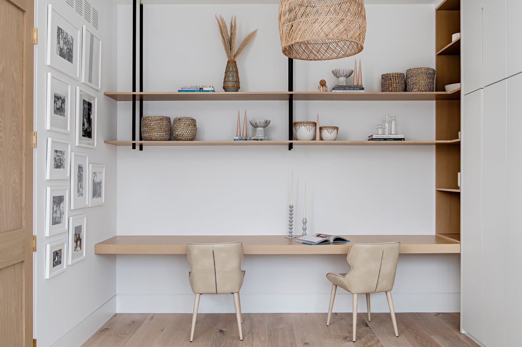 an interior view with midcentury modern furniture and northern wide wood planks on the floor