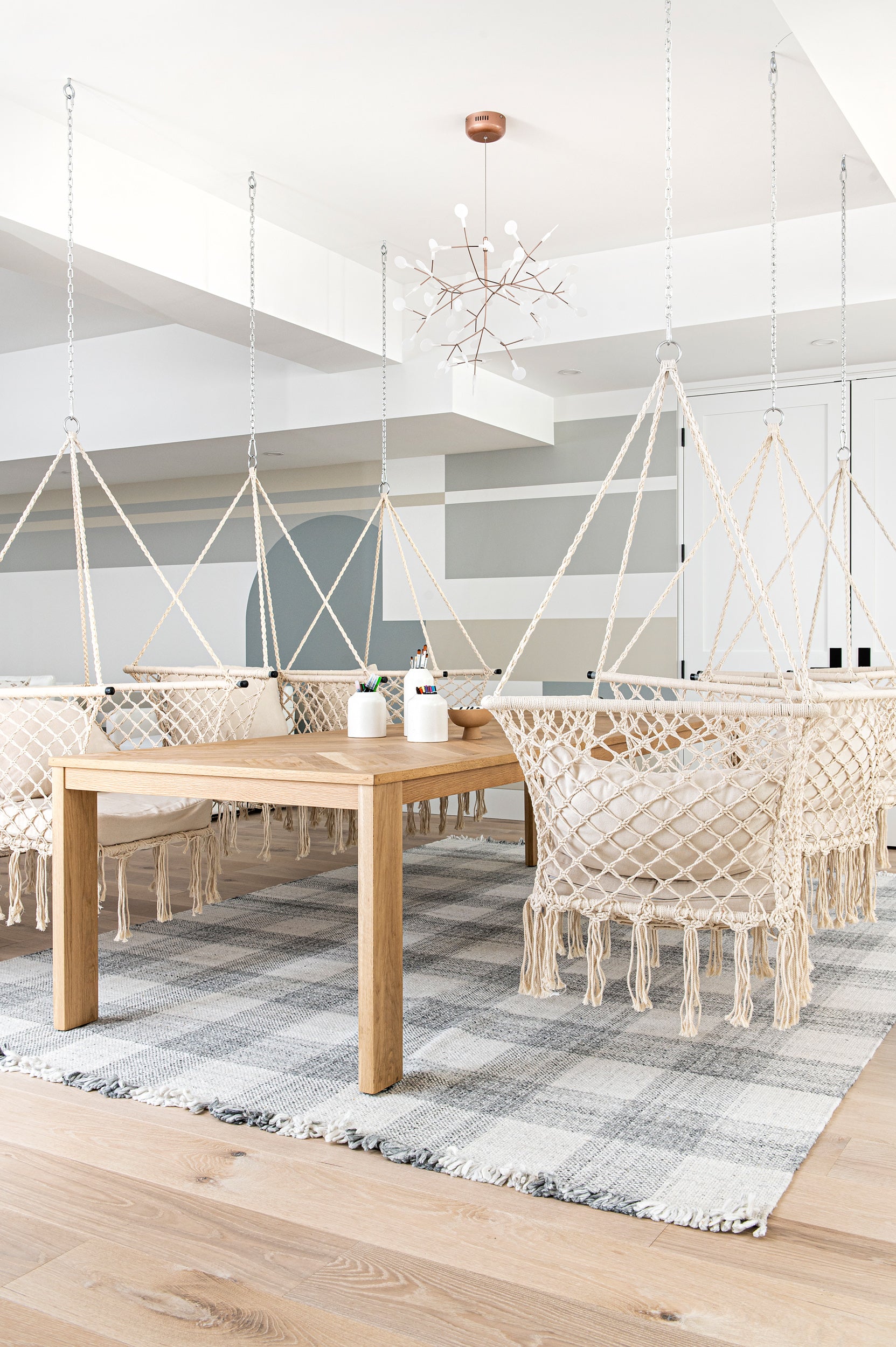 an interior view with midcentury modern furniture and northern wide wood planks on the floor