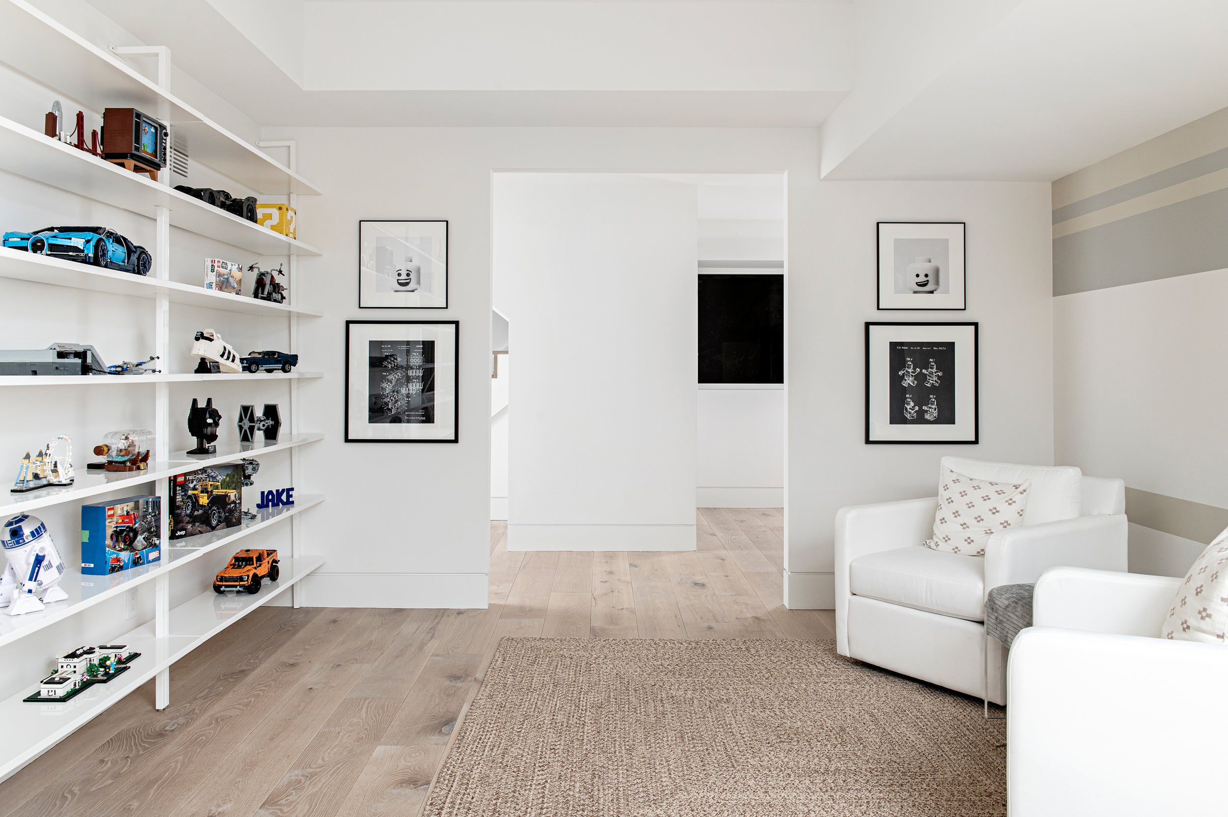 an interior view with midcentury modern furniture and northern wide wood planks on the floor