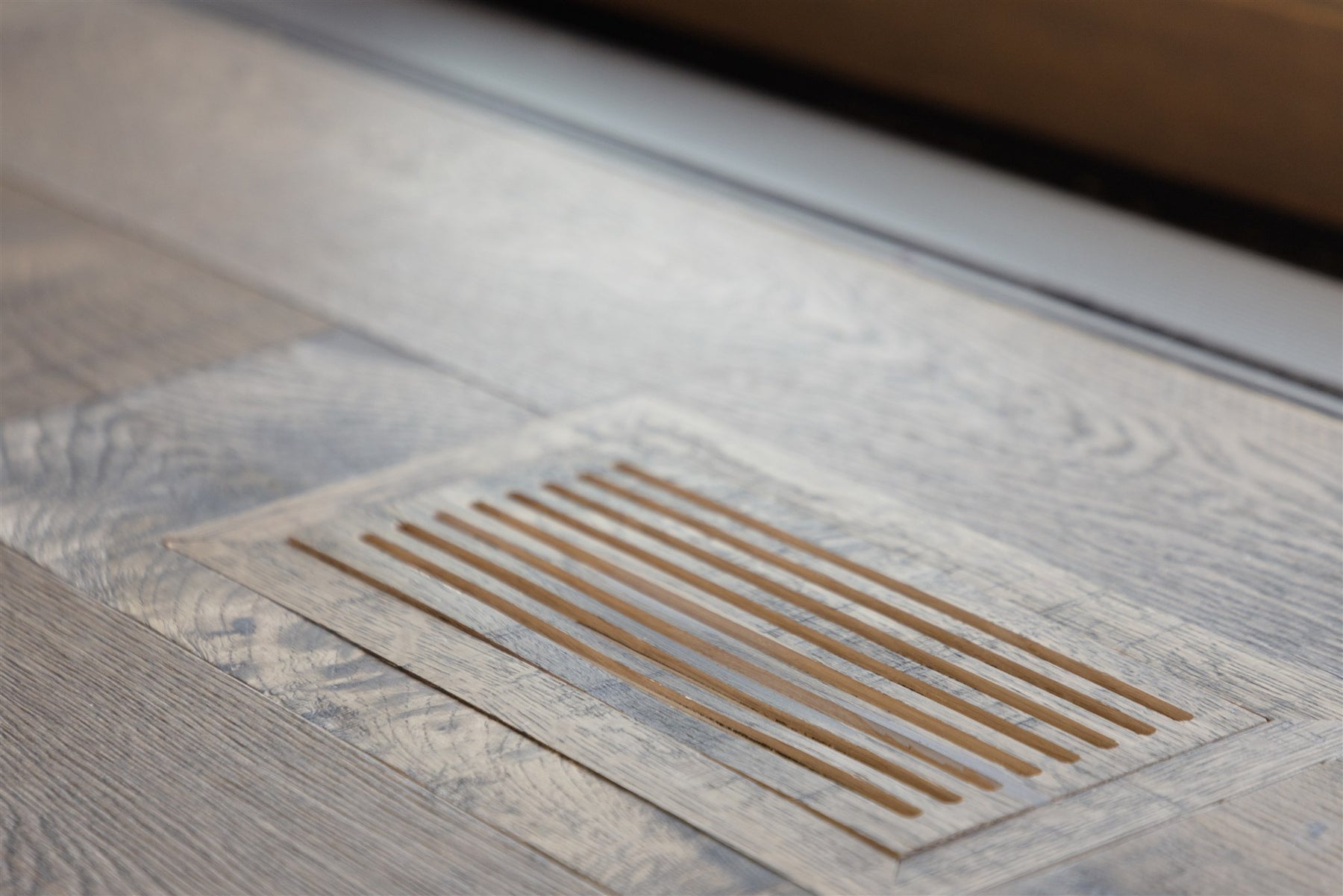 an interior view with midcentury modern furniture and northern wide wood planks on the floor