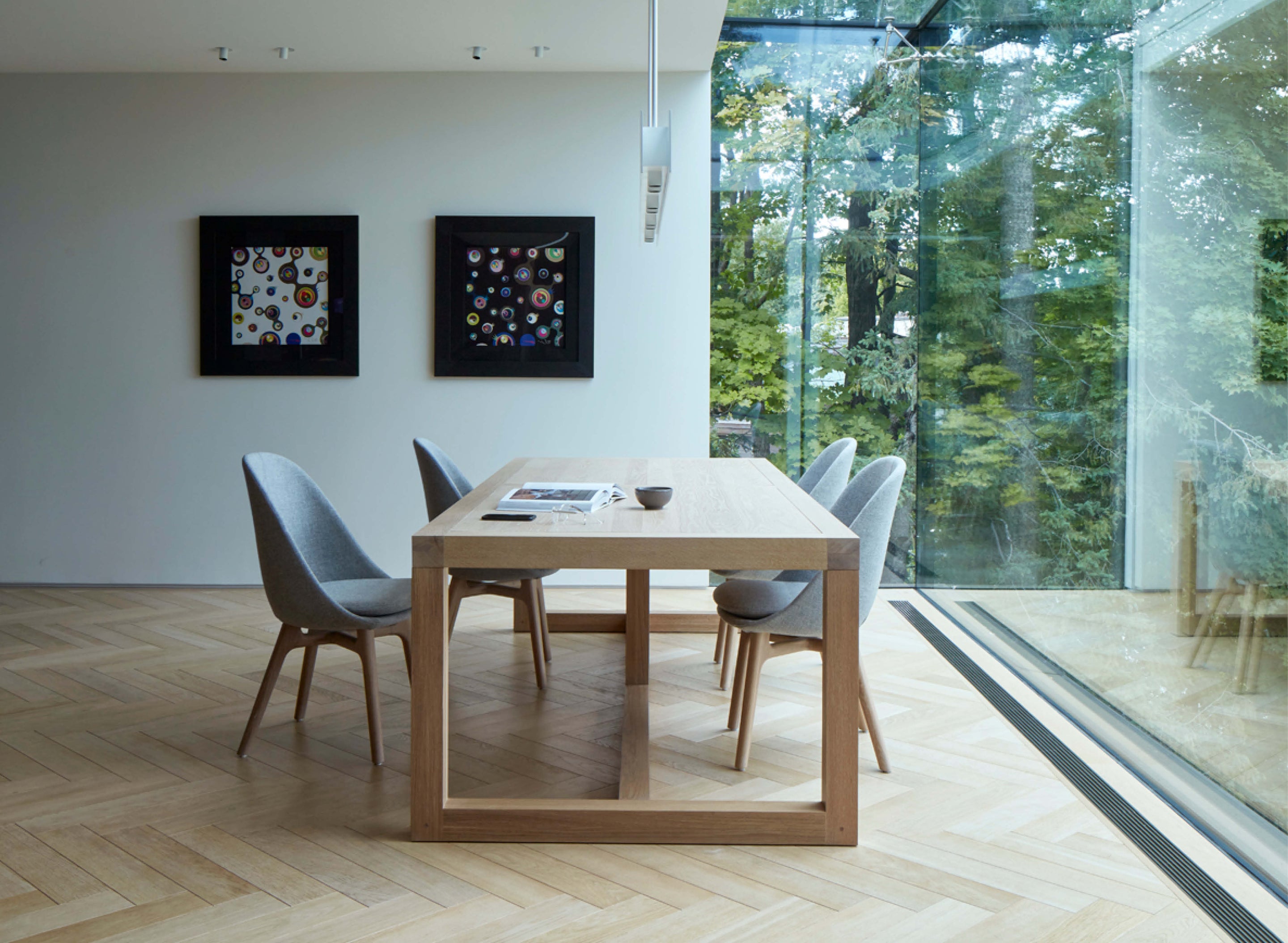 an interior view with midcentury modern furniture and northern wide wood planks on the floor